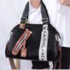Stylish Black Tote with Decorative Zippers and Dual Handles
