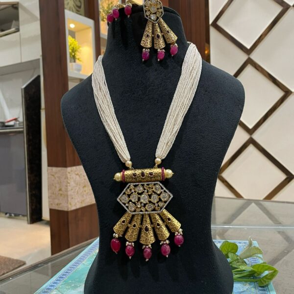 Multistrand Pearl Kundan Mala with Antique Golden Pendant and Ruby Beads